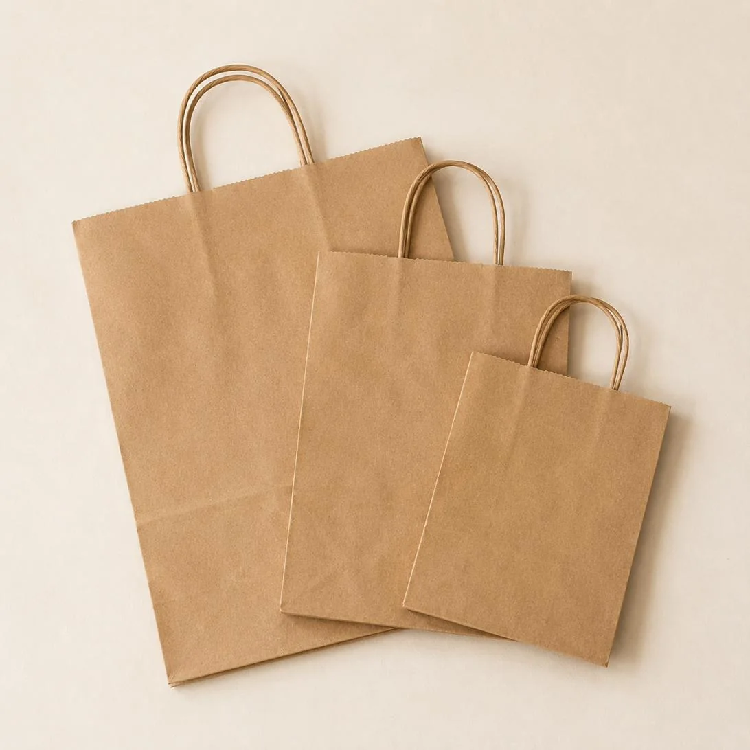 ACPP kraft carry bags shown in small, medium and large