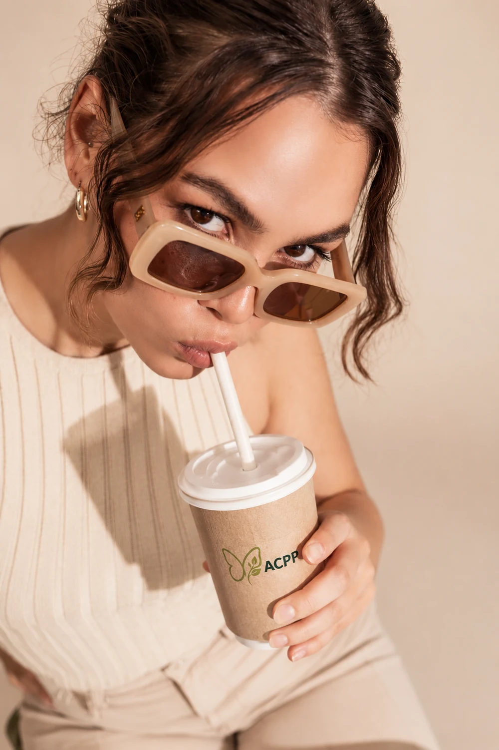 Customer drinking through an ACPP compostable straw